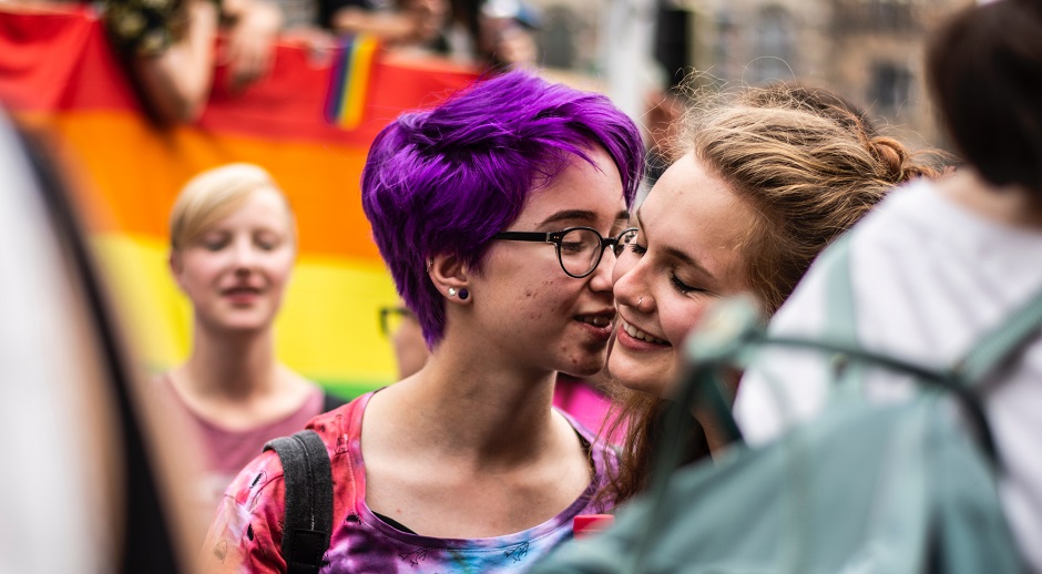 Two participants in a LGBT Pride march in Bremen, Germany. / <a target="_blank" href="https://unsplash.com/@janasabeth">J. Sabeth</a>, Unsplash, CC0,