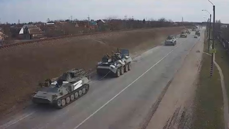 Footage shared on social media shows Russian tanks transiting through Ukrainian territory on 24 February 2022. / Social media,