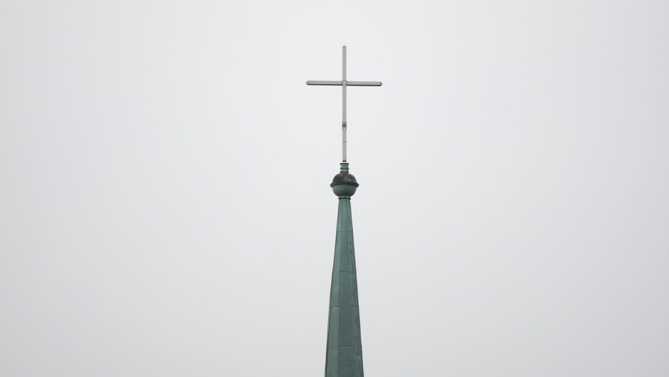 A church cross in Berlin, Germany. / Photo: <a target="_blank" href="https://unsplash.com/@annatherphoto">Anna Schroeder</a>, Unsplash, CC0.,