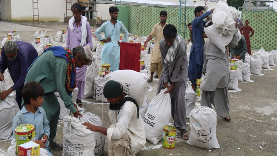 Humanitarian aid distributed in Pakistan after the floods. / Photo via J. Reimer and A. Rhemat.,