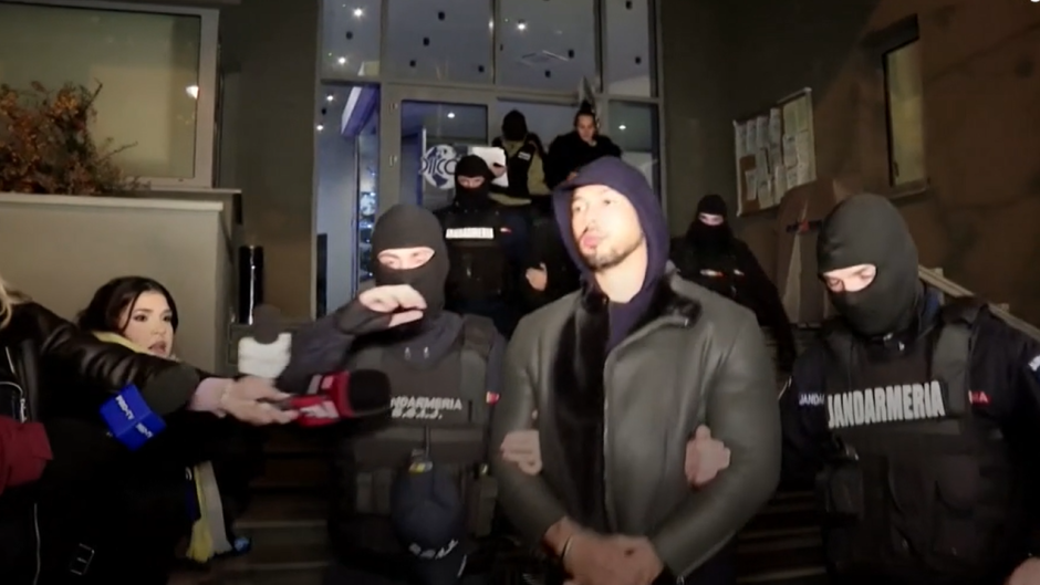 Andrew Tate leaves a police station in Romania after being detained in December 2022 accused of human trafficking. / Photo: Video caption of <a target="_blank" href="https://www.bbc.com/news/world-europe-64122628">BBC via Digi 24</a>.,