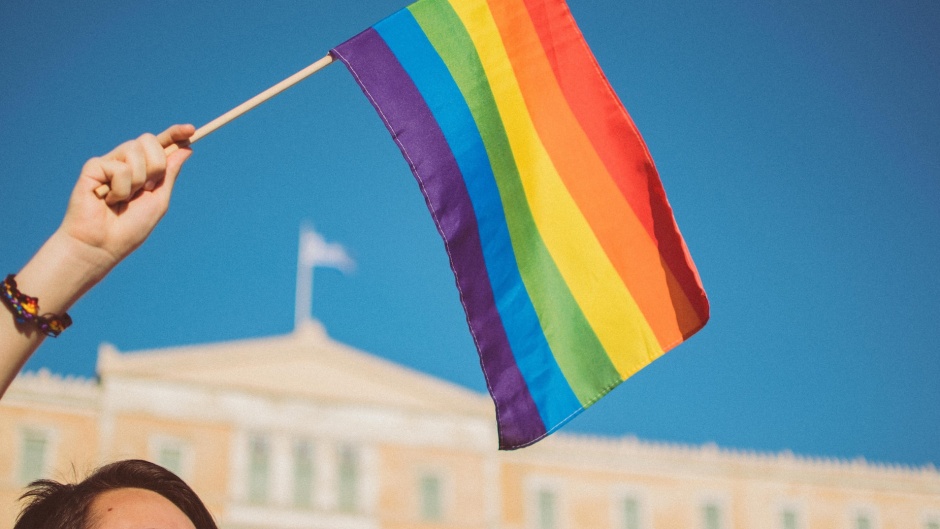 A LGBTQ+ Pride demonstration in front of the Greek national parliament, in Athens. / Photo: <a target="_blank" href="https://unsplash.com/@stavrialena">Stavrialena Gontzou</a>, Unsplash, CC0.,