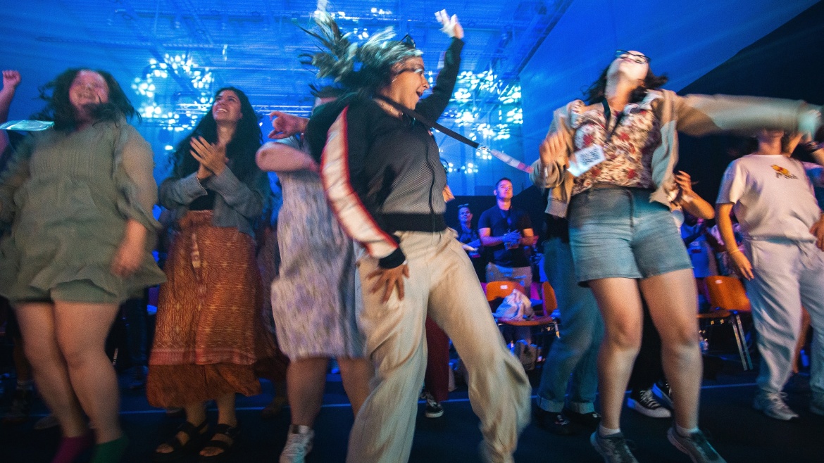 Students dance during a worship time at an IFES conference. / Photo: <a target="_blank" href="https://ifesworld.org/en/?switch_language=en">IFES</a>. ,