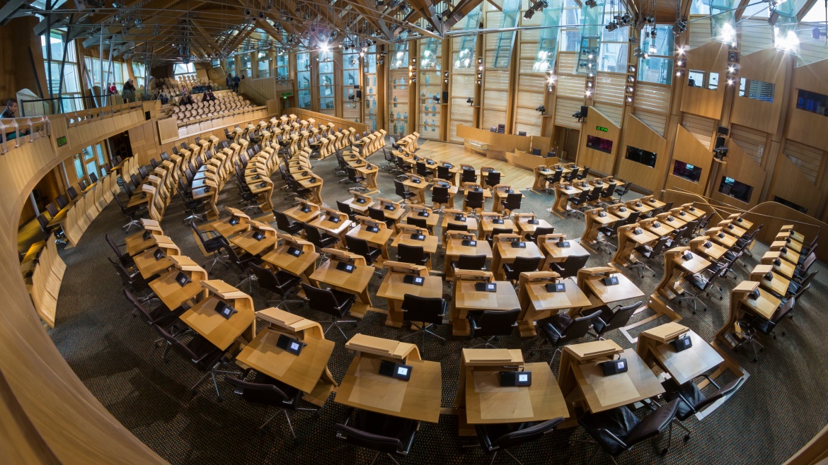 The Scottish Parliament. / <a target="_blank" href="https://commons.wikimedia.org/wiki/File:Scottish_Parliament_Debating_Chamber_3.jpg">Colin</a>, Wukimedia Commons.,