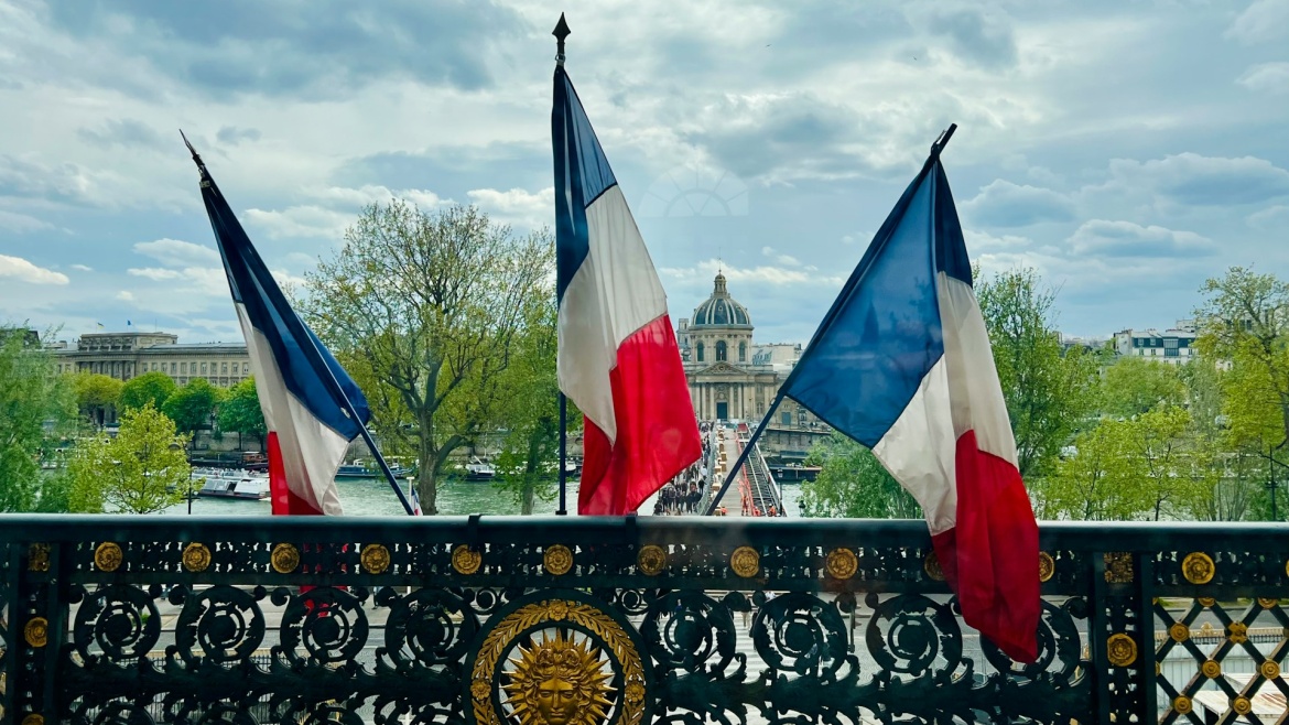 French flags in Paris. / Photo: <a target="_blank" href="https://unsplash.com/@sklepacki">Stephanie Klepacki</a>, Unsplash, CC0.,