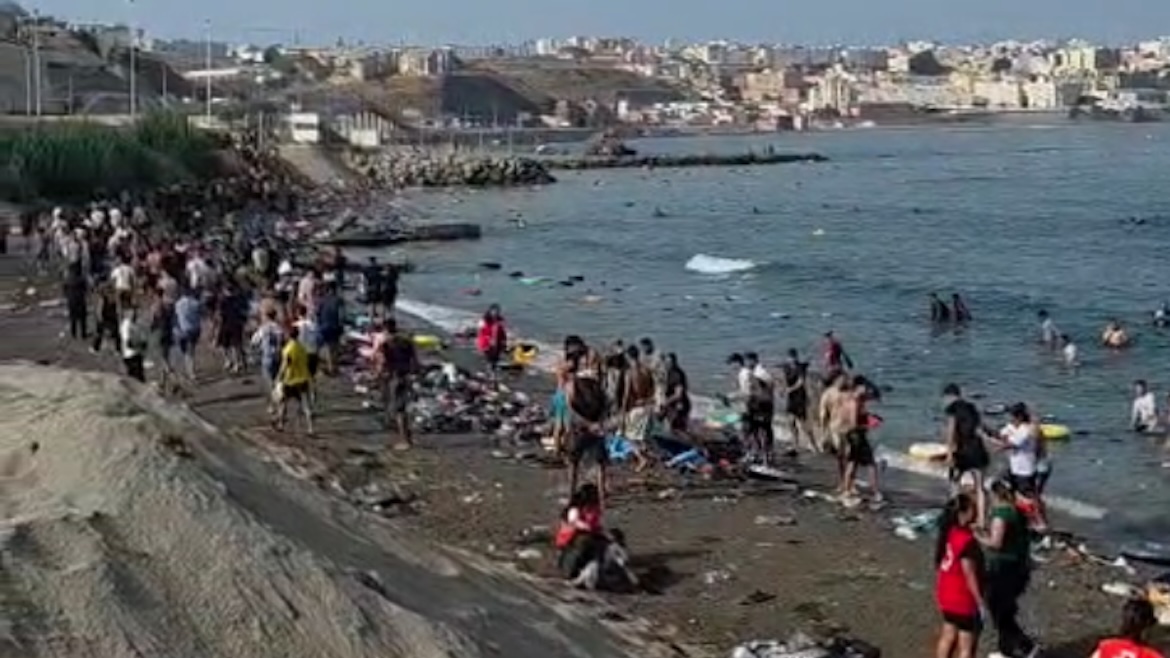 Red Cross teams are working to assist some of the thousands who have swum to Ceuta.,